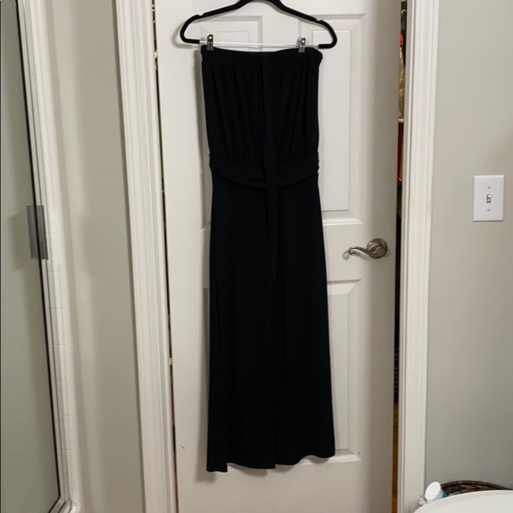 Black size Sm. One piece romper. 100% polyester.